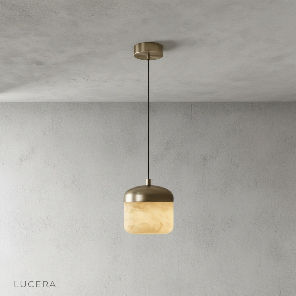 front view of Lucera Energico pendant light with polished copper details