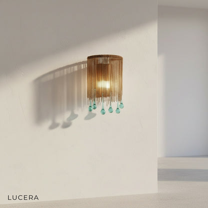 close-up detail of crystal and glass shade on Mesure wall lamp with warm LED light