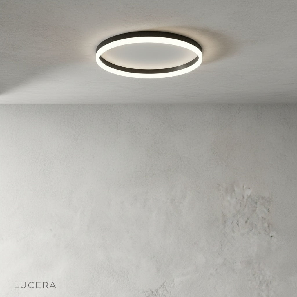 studio shot of round metal ceiling light with acrylic diffuser