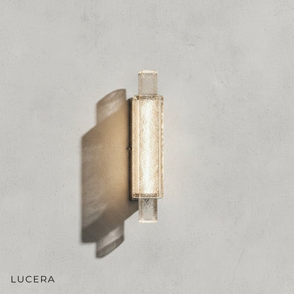 close-up of crystal accents on modern wall lamp with warm white light
