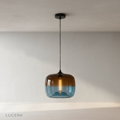 Minerva pendant light in green glass on clean white background, front view