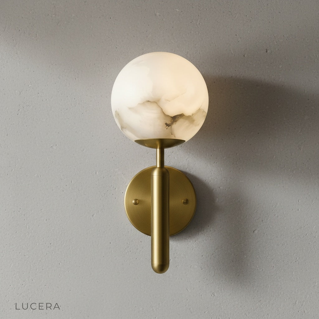 front view of alabaster wall lamp mounted on clean white wall, soft daylight