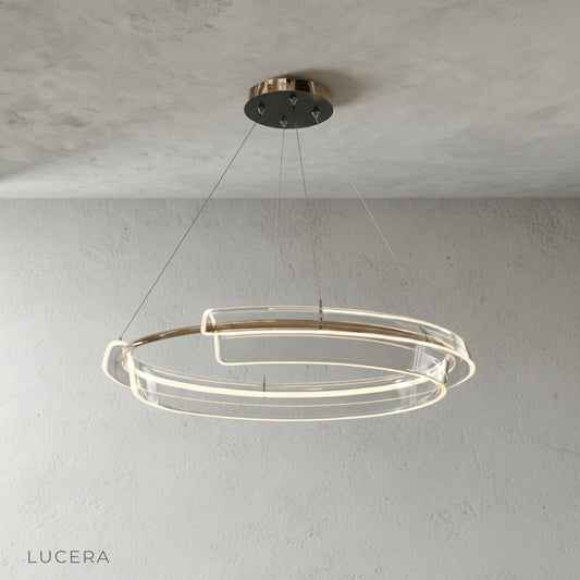 studio shot of copper dual-ring chandelier with iron frame and acrylic diffusers