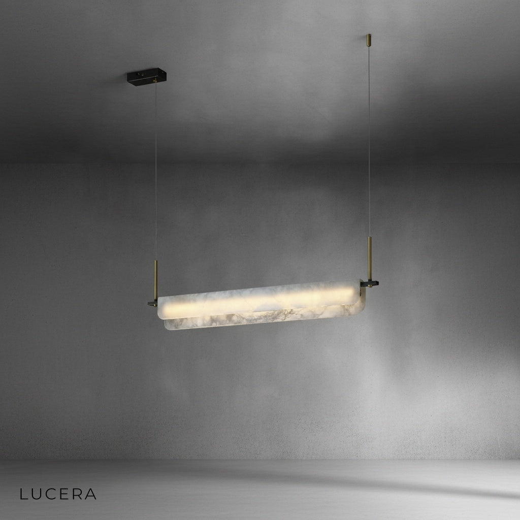 Warm 2700K setting on the linear pendant light casting cozy intimate glow over a small table