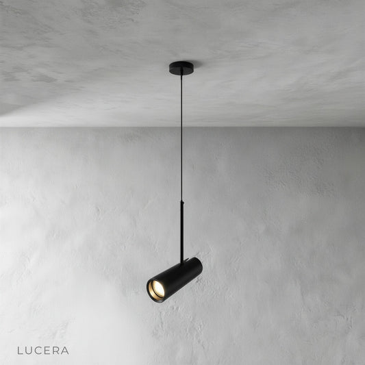 Studio shot of black Bistre pendant light with single cylindrical aluminum shade on clean background