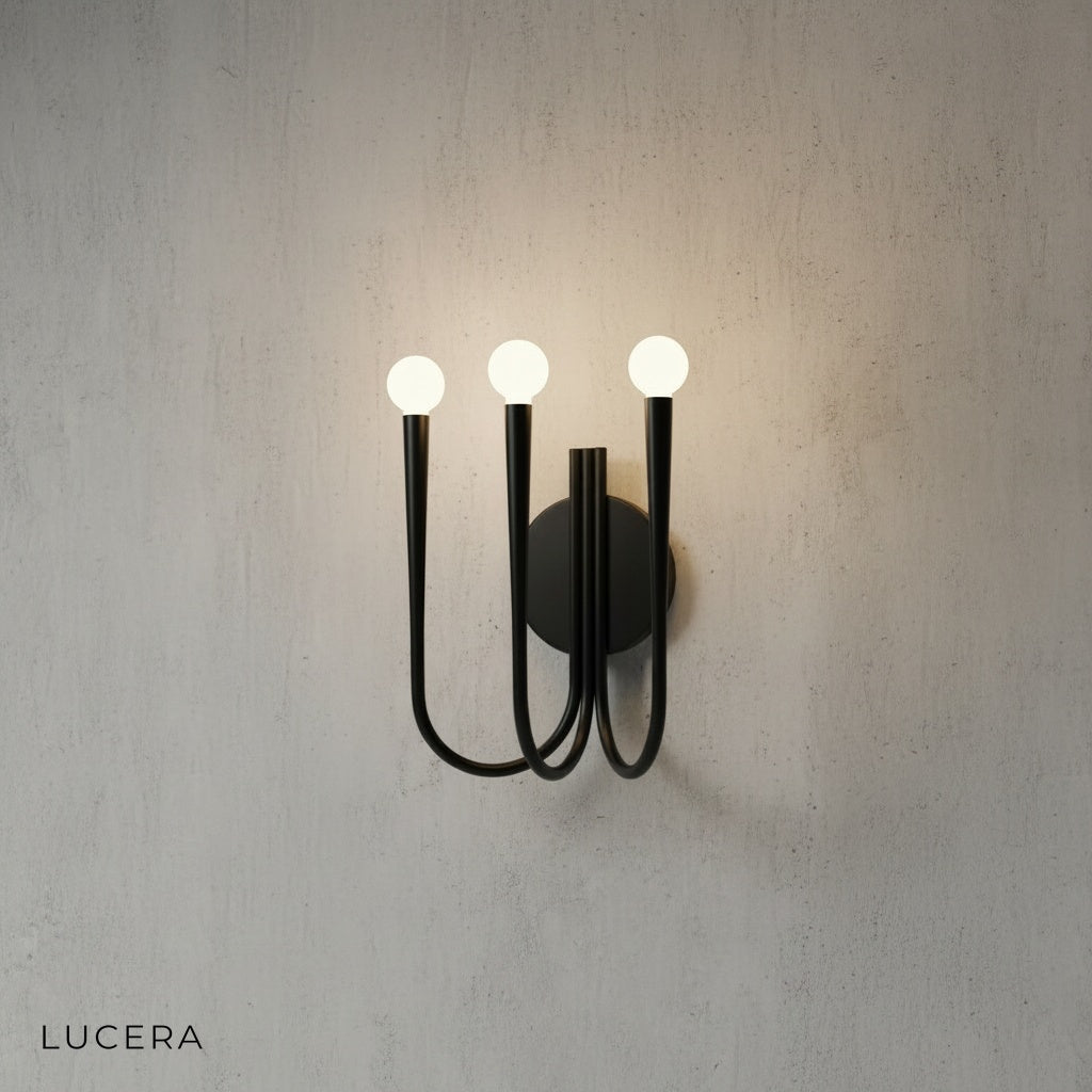 Close-up of Fiore Art-Deco sconce showing intricate metal lattice pattern and warm LED light glow