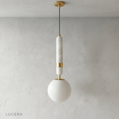 Cylindrical marble top pendant light with frosted glass globe front view