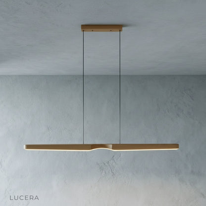 front view of Ember wood pendant light showcasing sleek wood grain and matte finish in studio setting