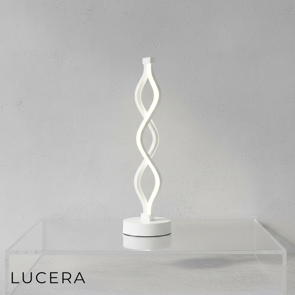 Close-up of spiral LED lamp showing cool white light setting and brushed aluminum texture