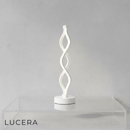 Close-up of spiral LED lamp showing cool white light setting and brushed aluminum texture