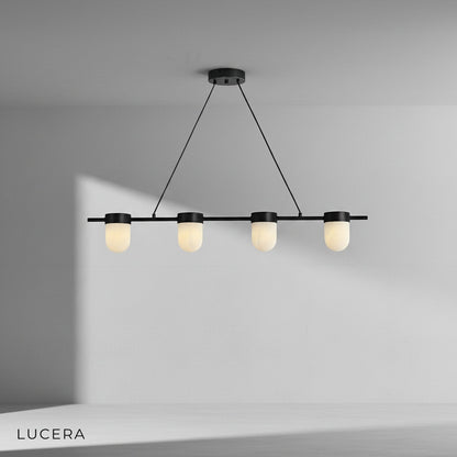Overhead view of linear chandelier showing symmetrical arrangement of alabaster globes