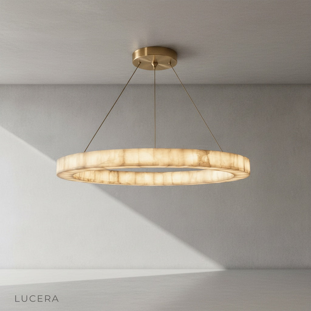 Minimalist studio view of the round alabaster chandelier centered against a clean white background