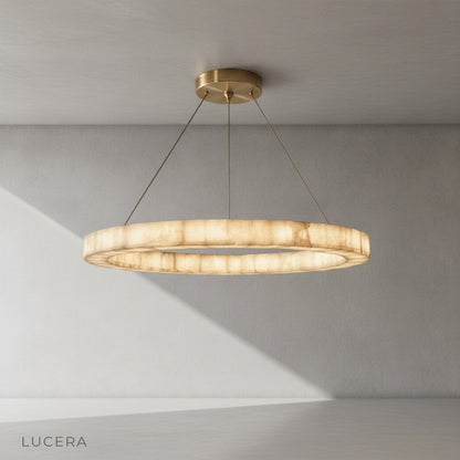 Minimalist studio view of the round alabaster chandelier centered against a clean white background