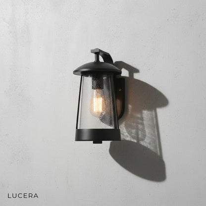 Camille LED wall sconce front view on neutral gray studio background