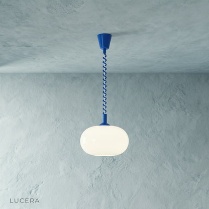 Xanthous pendant light studio side view showing rounded opal glass diffuser