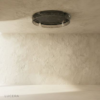 close-up of geometric metal cutouts on the Knight ceiling light against white background