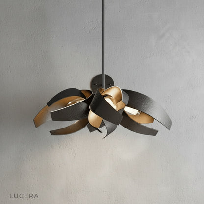 Incanto Chandelier studio shot on clean white background showing flowing stainless steel ribbons