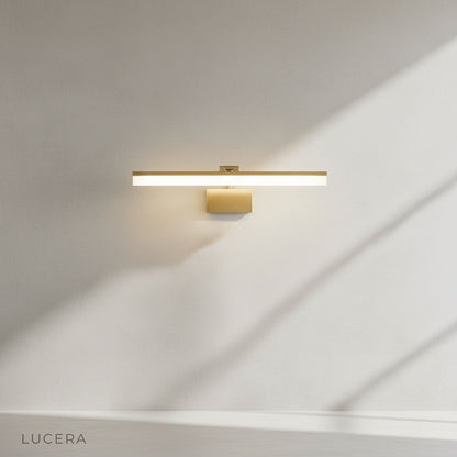 front view of sleek balance wall lamp mounted on clean white wall