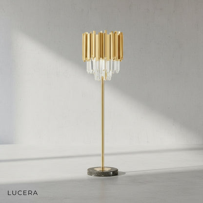 close-up of gold metal base and cobalt crystal spheres on floor lamp