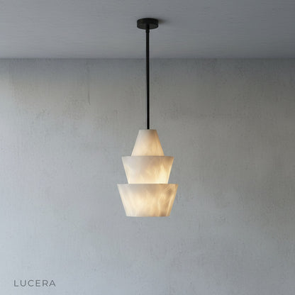 Minimalist studio view of Fillet Alabaster pendant light from side angle with soft shadows