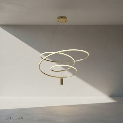 Apostle Chandelier gold abstract spiral design close-up studio view against neutral backdrop