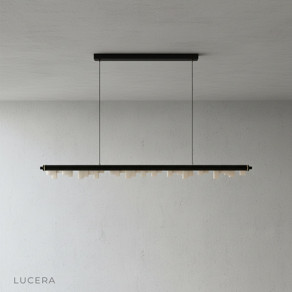 Minimalist studio view of the linear skyline-inspired pendant light from Lucera in a clean white setting