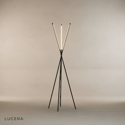 Iolite floor lamp with warm glow illuminating cozy reading corner with neutral decor