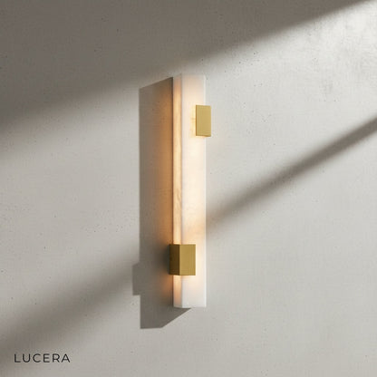 Dendral wall lamp with warm 3000K LED light illuminating marble surface