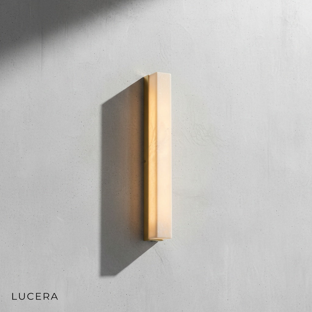 Close-up of marble texture and warm LED glow through stone panel on wall lamp