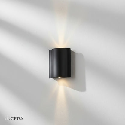 Close-up studio shot of rectangular Sable Black aluminum outdoor wall light fixture