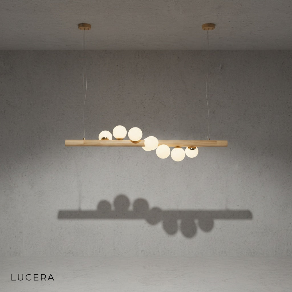 close-up detail of walnut wood arm and clear glass sphere on Svartr LED chandelier