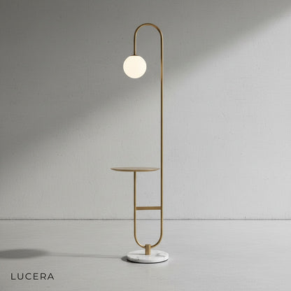 Close-up of the Chrysoprase floor lamp's round table surface and brushed metal stem detail