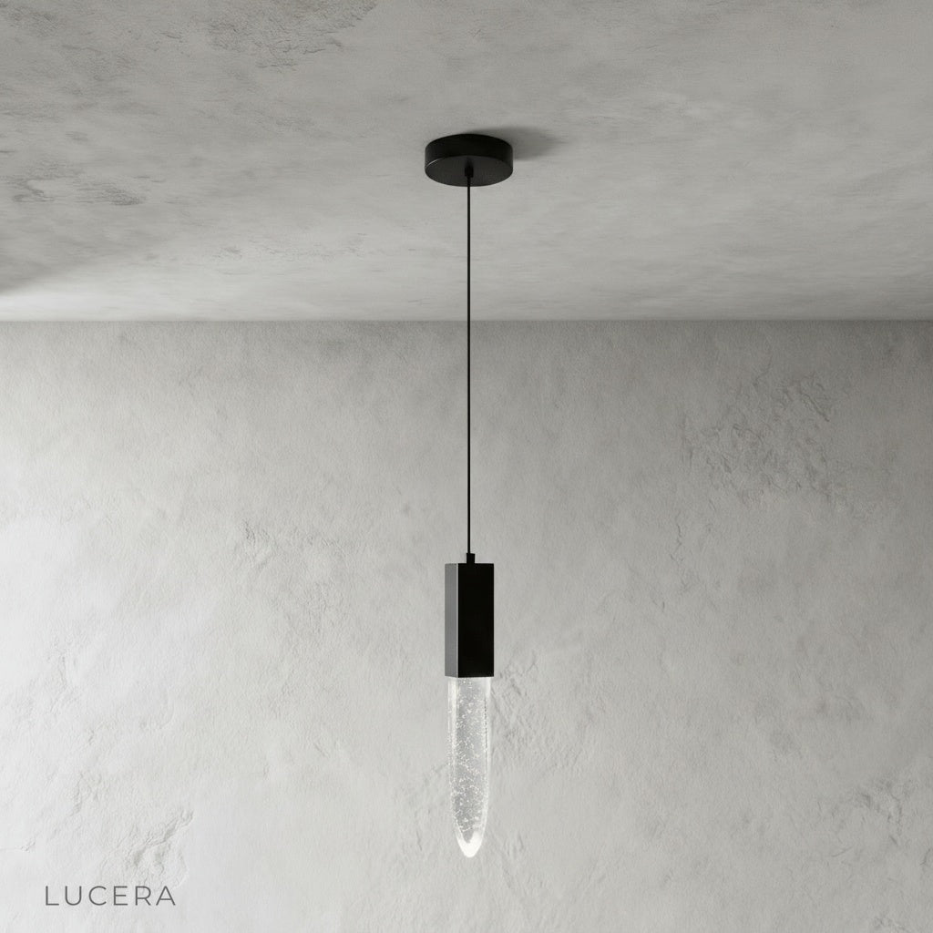 front view of Terra pendant light showing sleek metal frame and crystal details