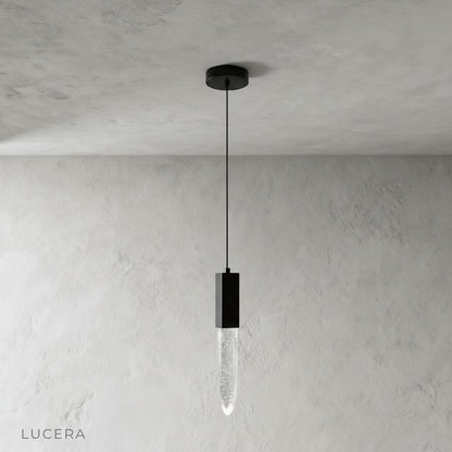 front view of Terra pendant light showing sleek metal frame and crystal details
