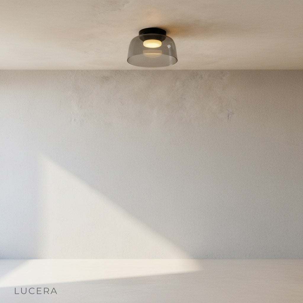 minimalist studio view of Desdemona flush mount light showing layered glass rings and brushed metal