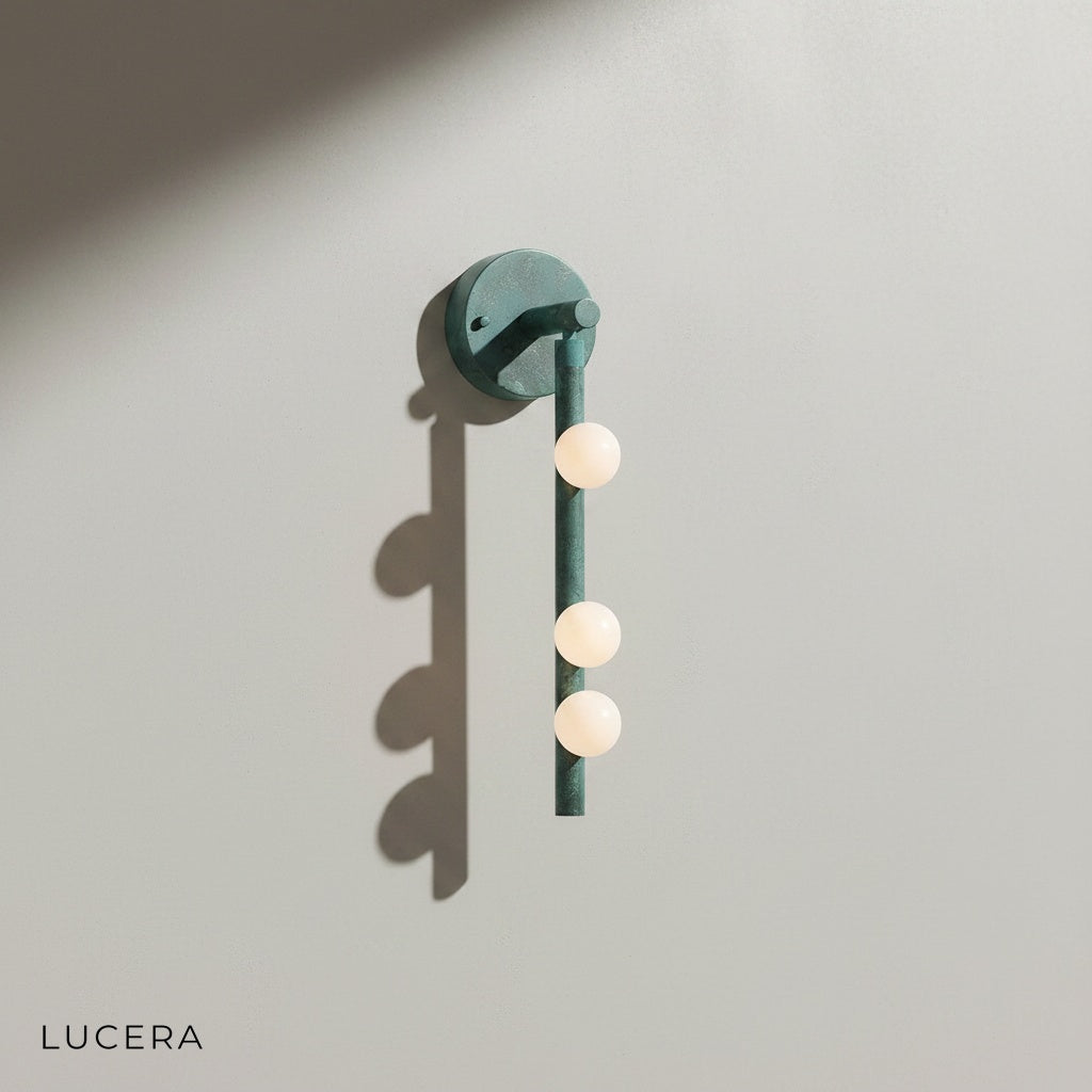 Lucera retro wall sconce with clear glass shade showing warm filament bulb