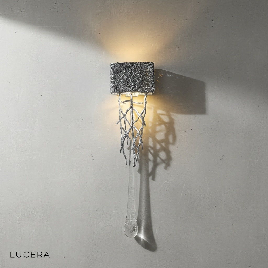 Rallentando copper crystal wall light with cool white LED glow in modern office setting