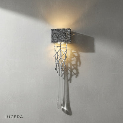 Rallentando copper crystal wall light with cool white LED glow in modern office setting