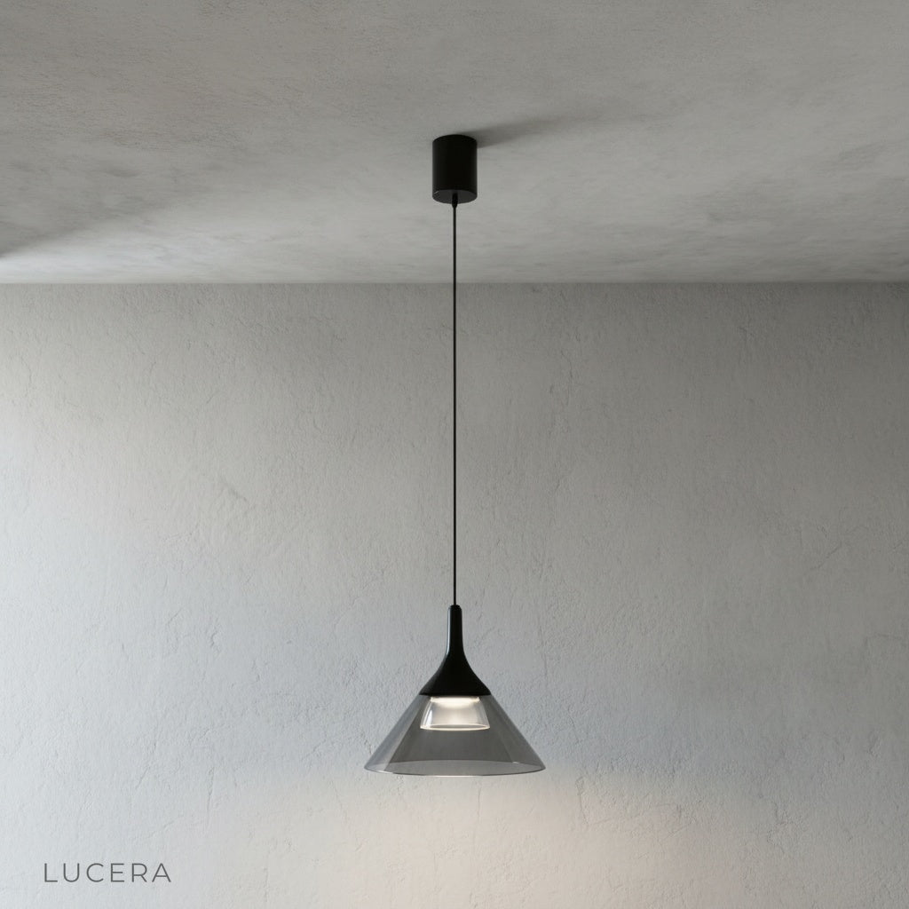 Calypso Pendant Light side view in studio, conical glass shade reflecting soft light