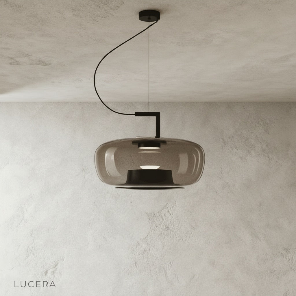 Yardang pendant light front view studio shot with clear glass shade and black metal frame