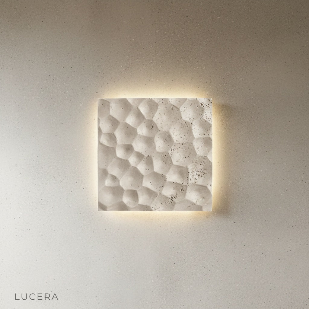 Hexagonal black stone wall sconce side angle studio product shot