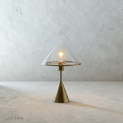 Front view of Lucera aluminum table lamp with clear glass globe on white background