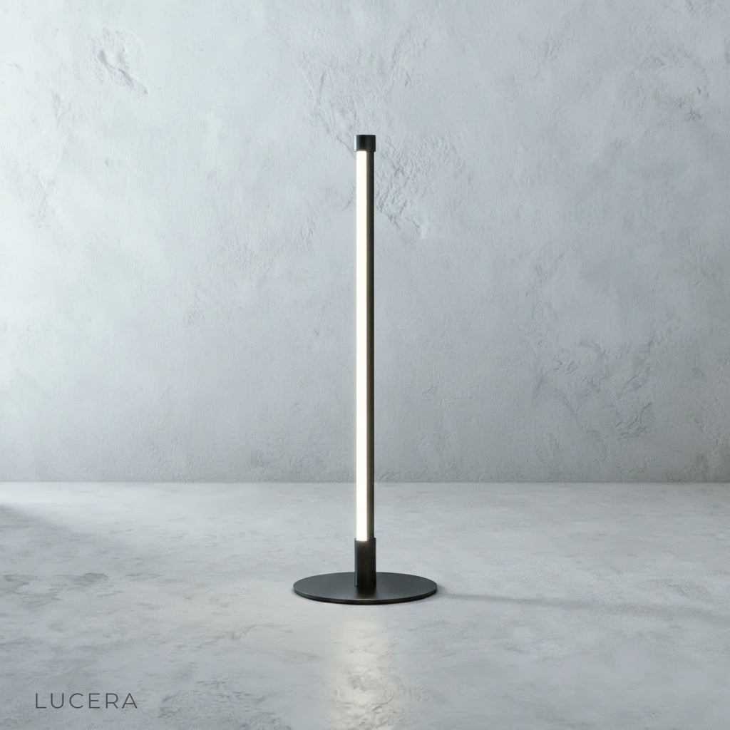 Sleek black Pascal Table Lamp with circular base, studio product shot on grey backdrop