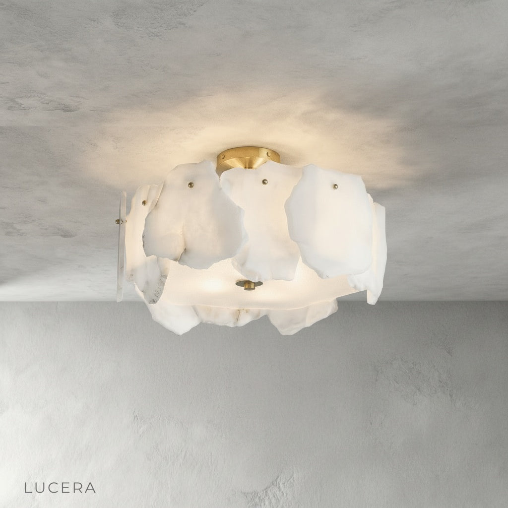 Studio shot of Fulgurant ceiling light showing circular petal-like alabaster marble design
