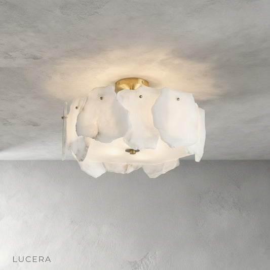 Studio shot of Fulgurant ceiling light showing circular petal-like alabaster marble design