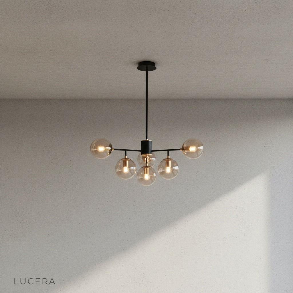 Yett chandelier hanging at eye level showing symmetrical glass arm arrangement