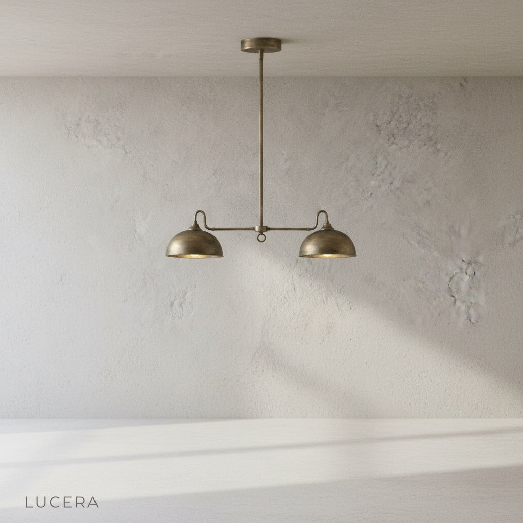 Montepulciano pendant light studio angle view polished brass central stem and twin dome silhouette