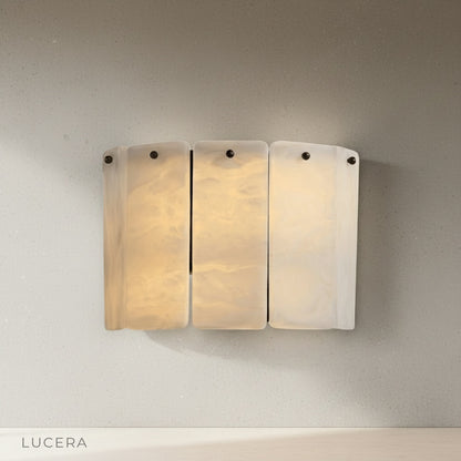 gravitas wall lamp side profile studio shot marble panels