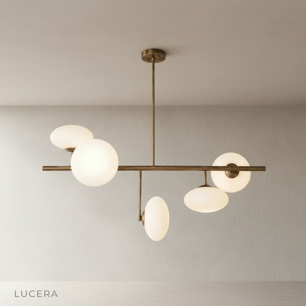 Studio shot of Naples Yellow Chandelier front view with five opal glass globes
