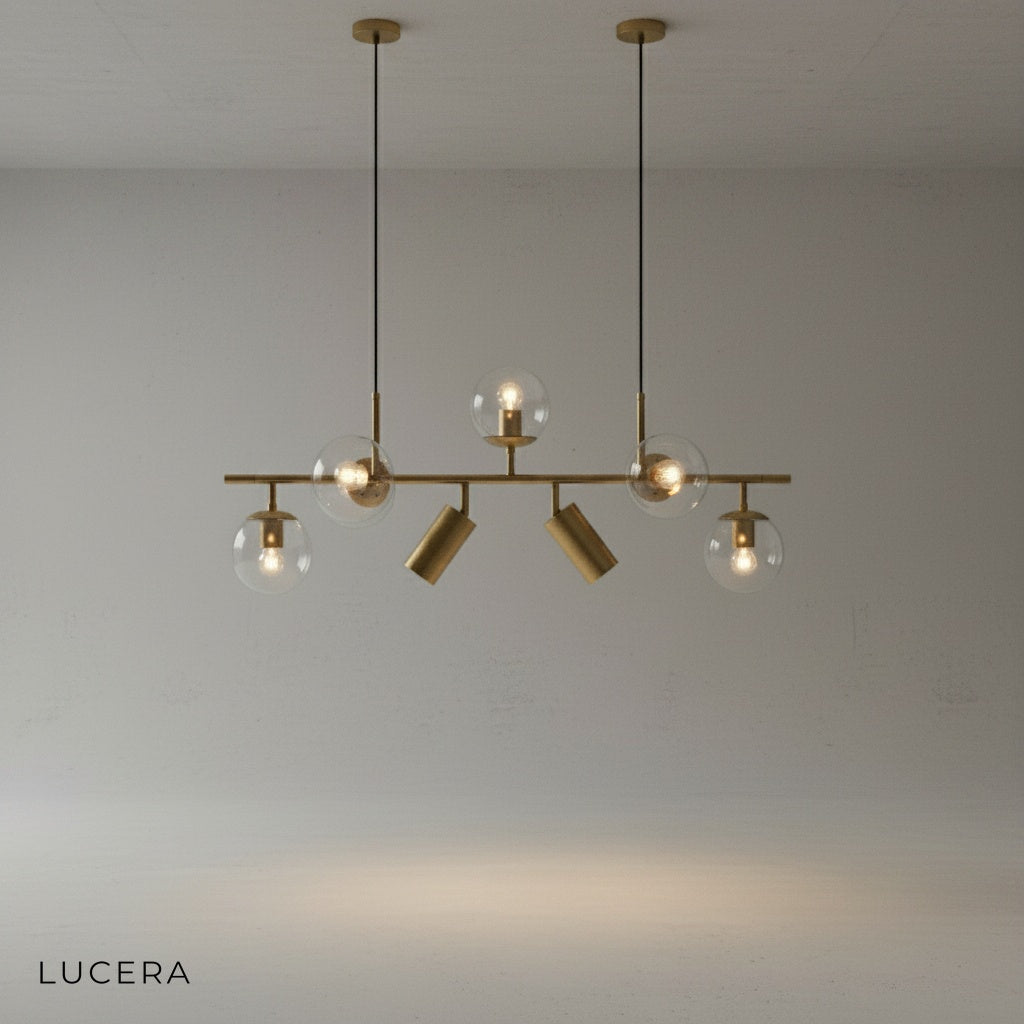 adjustable cord hanging gold chandelier with glass balls above dining table